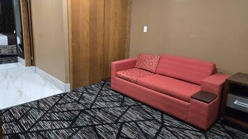 Queen Suite with Sofa Bed | Living room | 36-inch TV with satellite channels