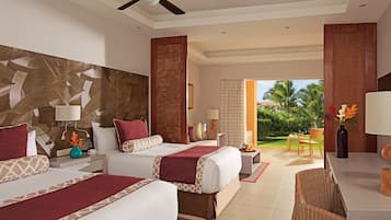 A hotel room with two beds, a dining area, and a view of the outdoors.