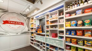 A snack aisle with various chips and snacks. - Hampton Inn Suites Opelika I85 Auburn Area (Opelika)