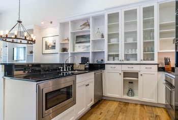 Full-size fridge, microwave, oven, stovetop at WaterSound Inn