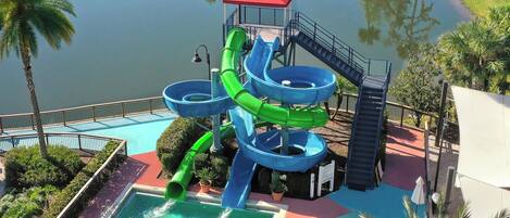A water park with multiple slides and a pool.