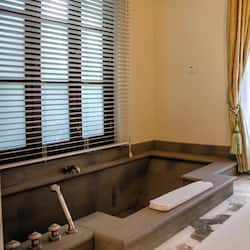Suite, 1 King Bed (Garden) | Bathroom | Separate tub and shower, deep soaking tub, designer toiletries