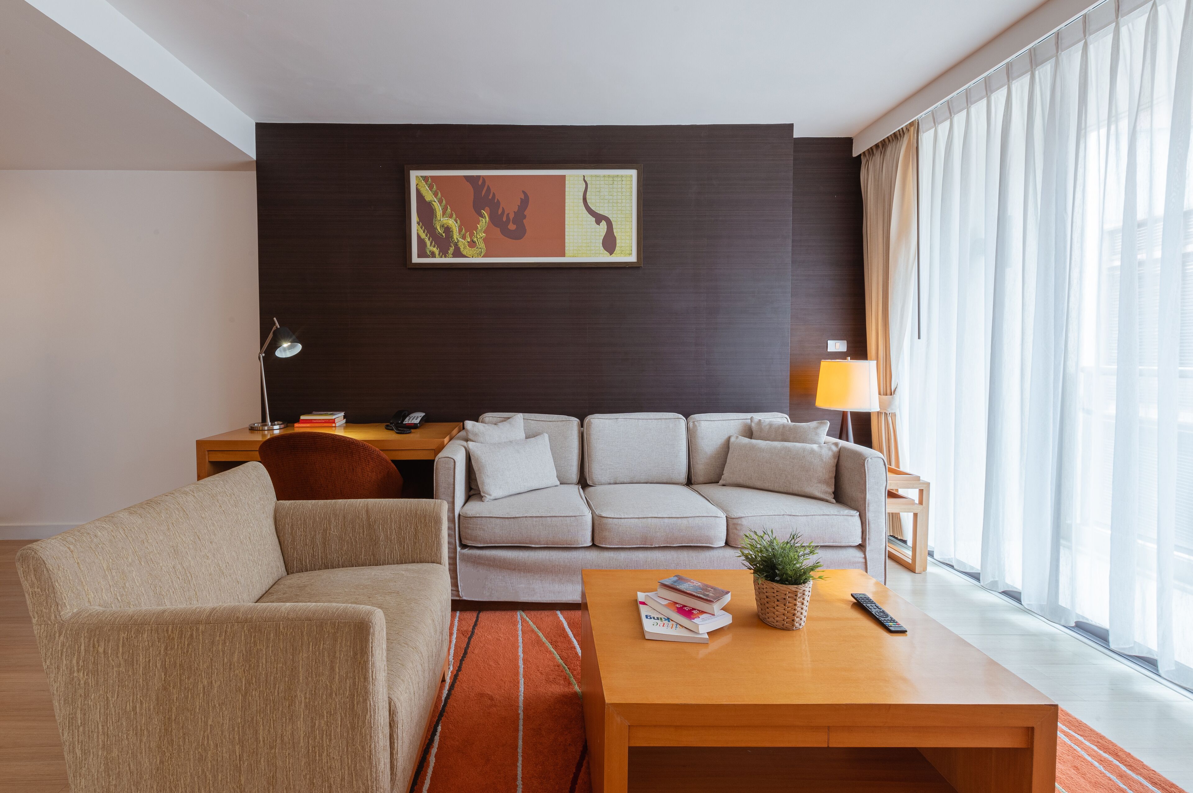 one bedroom suite | living room | 42-inch flat-screen tv with cable/satellite tv channels, tv, dvd player