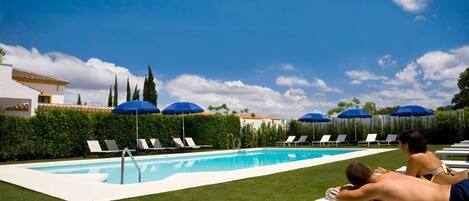 Seasonal outdoor pool, open 10:00 AM to 8:00 PM, pool umbrellas