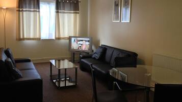 Apartment, 1 Bedroom (4 Guests) | Living area | 32-inch TV with digital channels