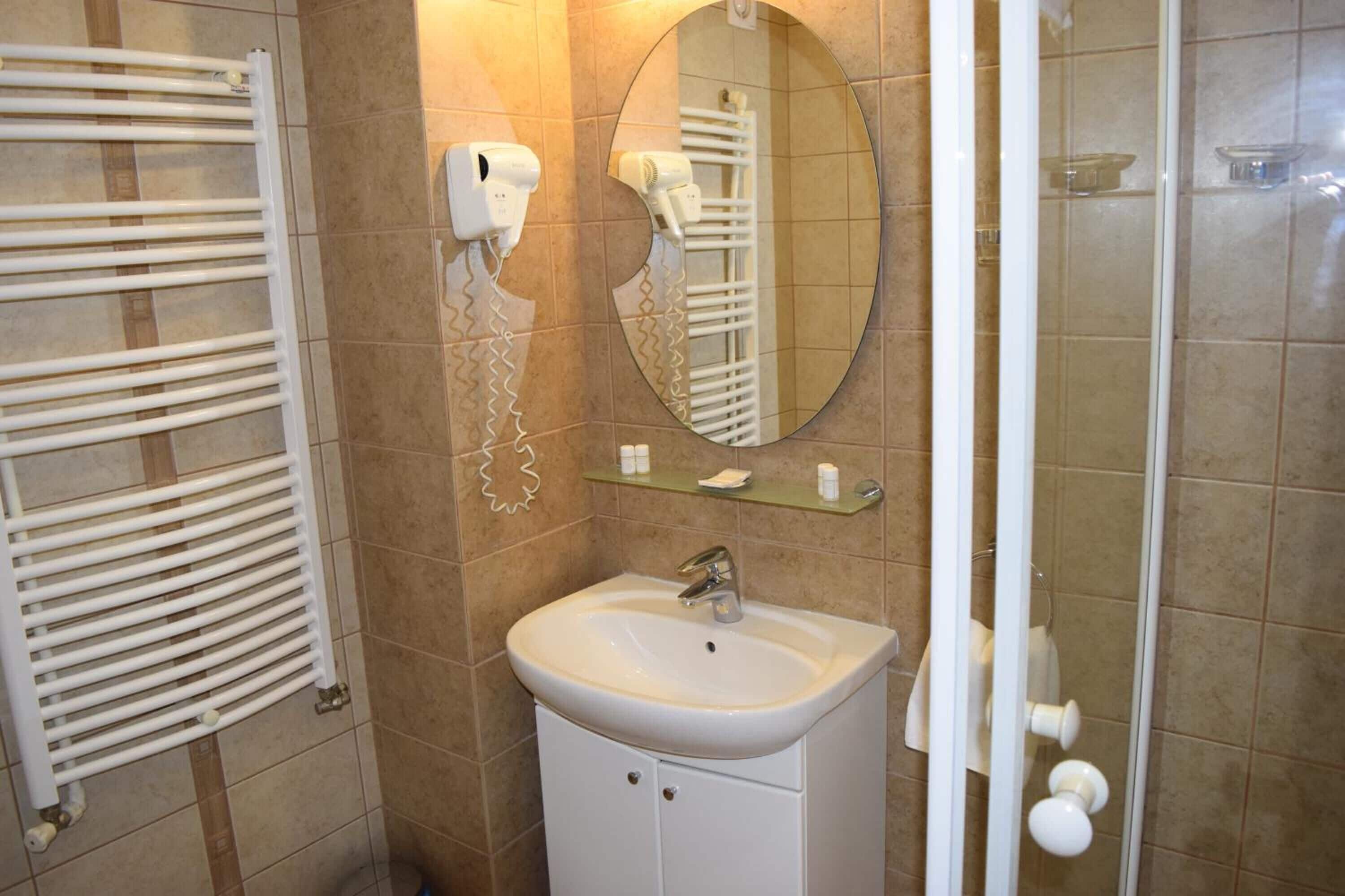 shower, hair dryer, bidet, towels