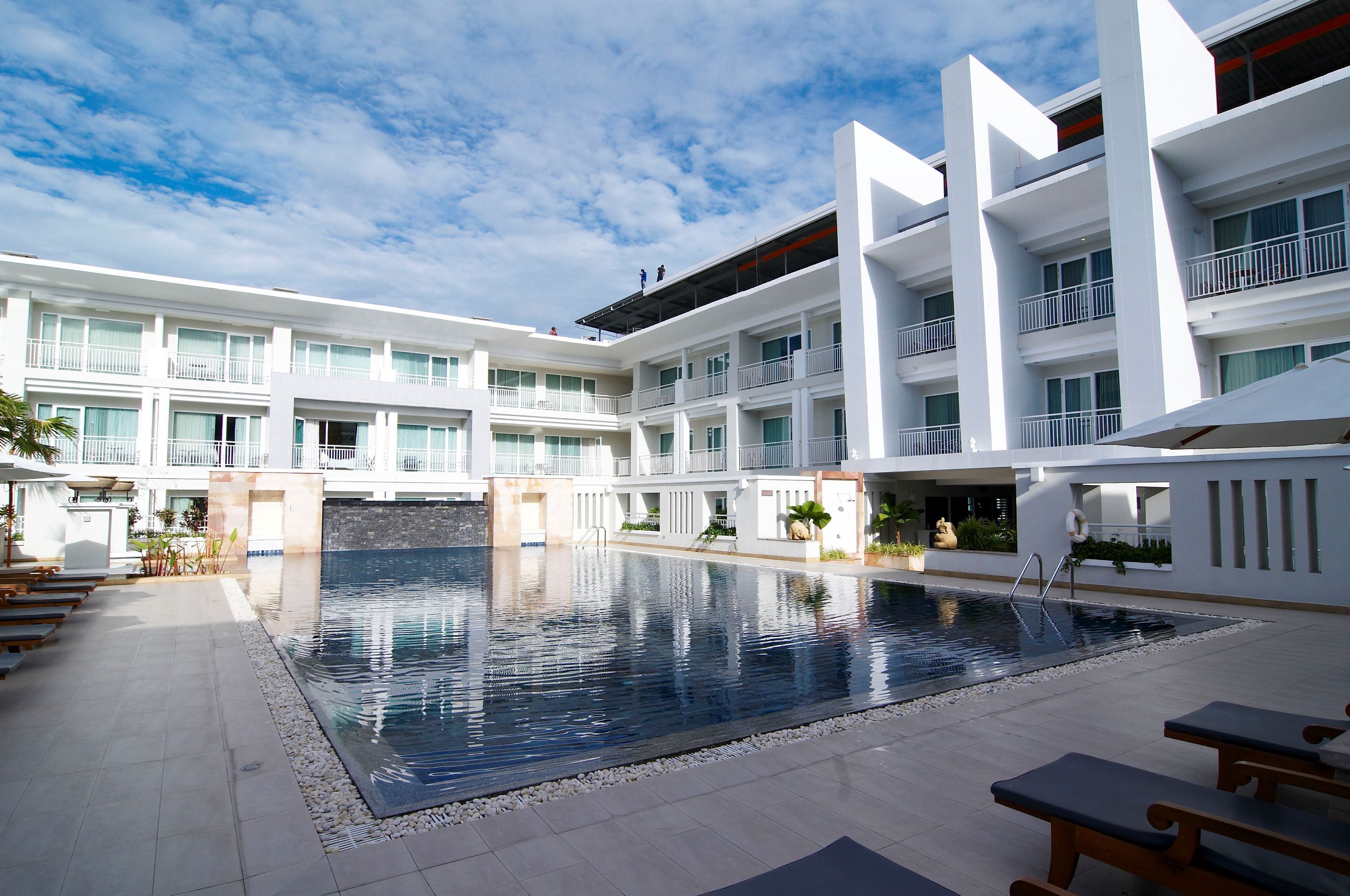 outdoor pool, pool umbrellas, pool loungers