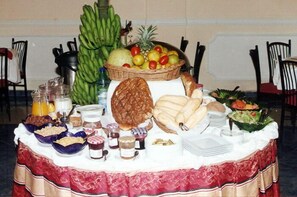 Daily buffet breakfast (USD 13 per person)