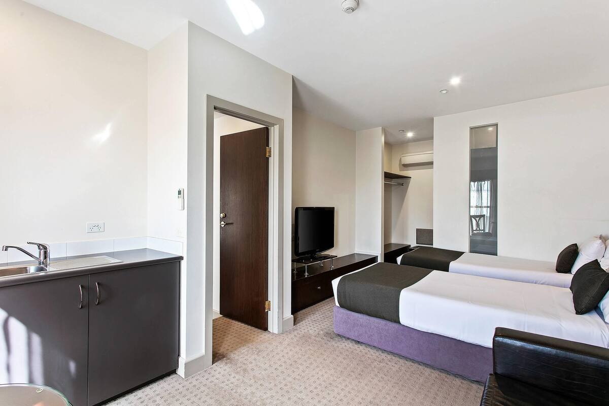Room, Multiple Beds, Non Smoking | Minibar, in-room safe, desk, iron/ironing board