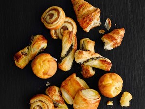 A variety of pastries on a dark surface. - ibis London Elstree Borehamwood (Borehamwood)