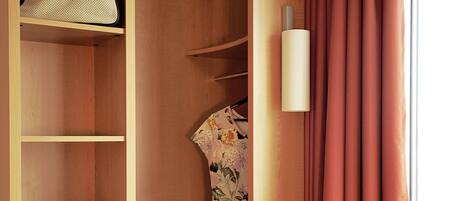 A wooden wardrobe with shelves, a hanging garment, and a pair of shoes.
