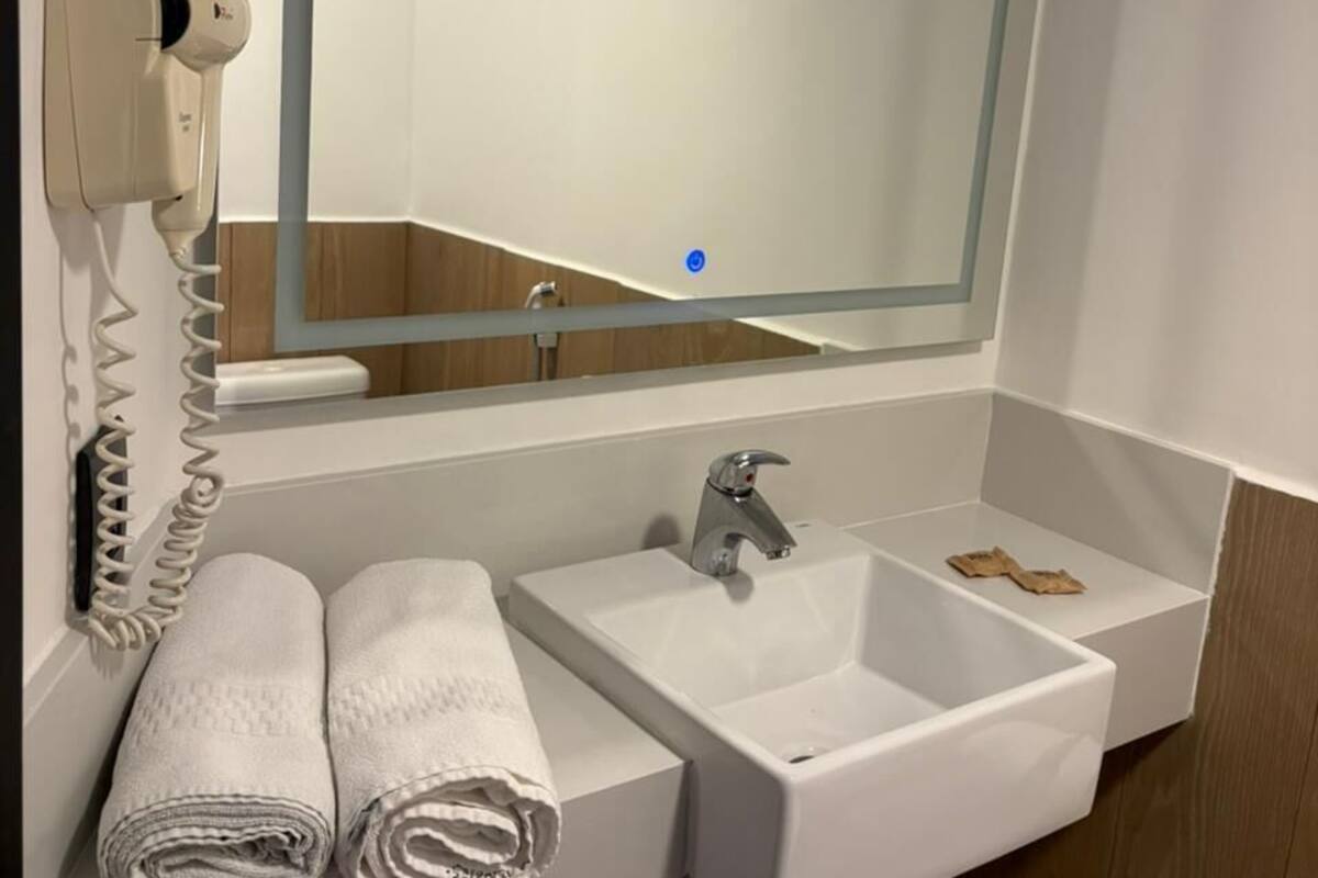 Shower, eco-friendly toiletries, hair dryer, towels