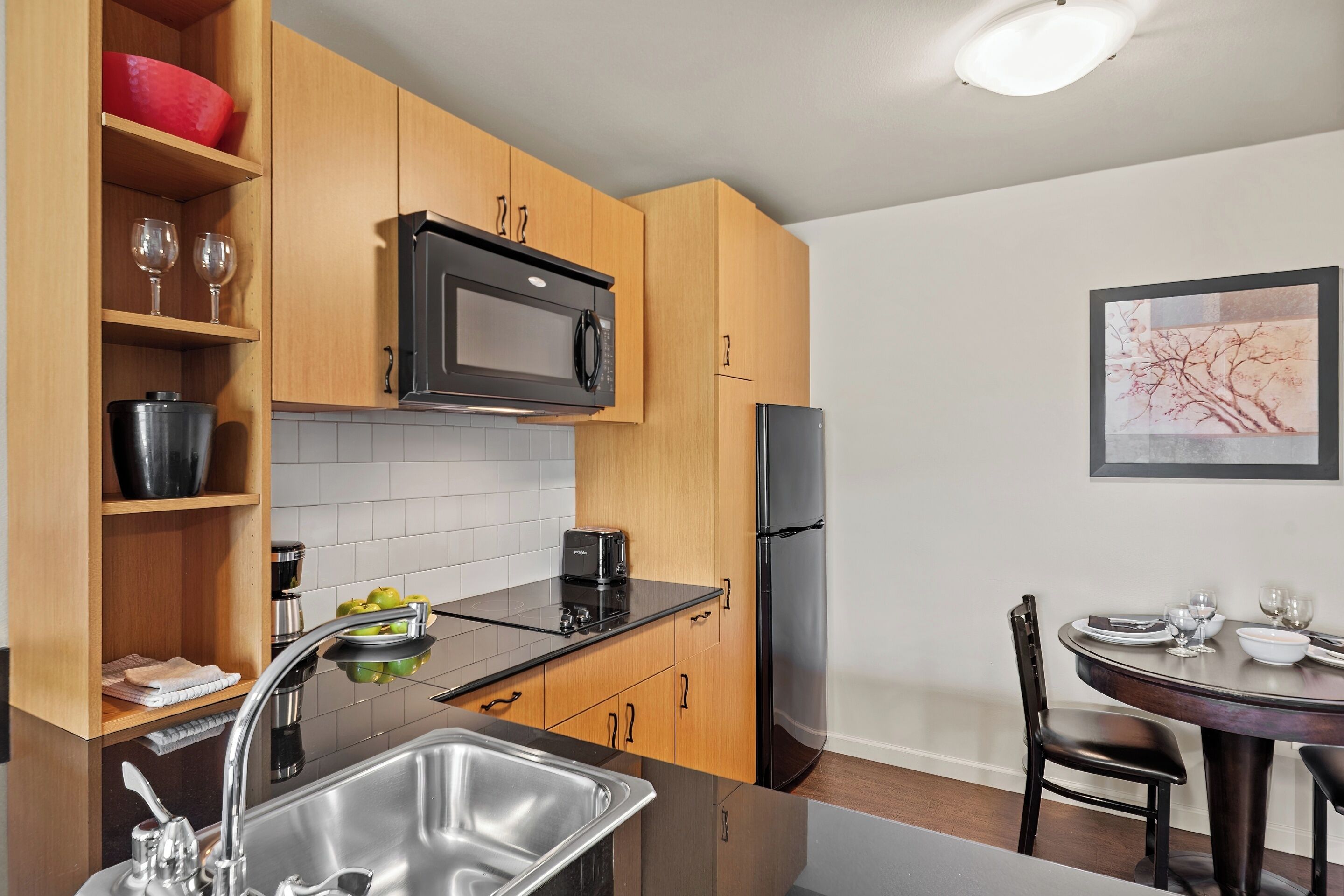 full-sized fridge, microwave, stovetop, dishwasher