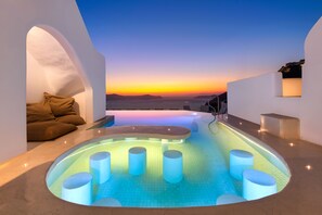 Outdoor pool, open 9:00 AM to 9:00 PM, pool umbrellas, pool loungers - Athina Luxury Suites (Santorini)