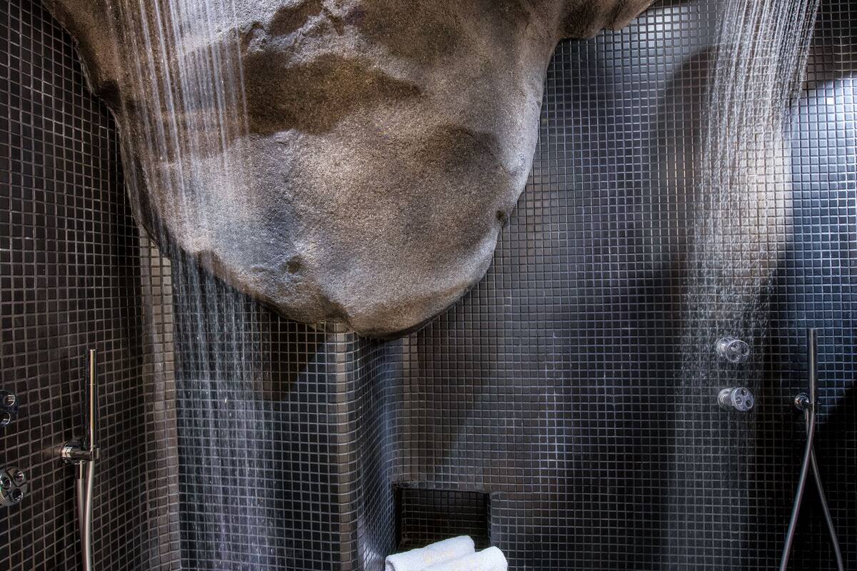 junior cave suite | bathroom | shower, designer toiletries, hair dryer, bathrobes