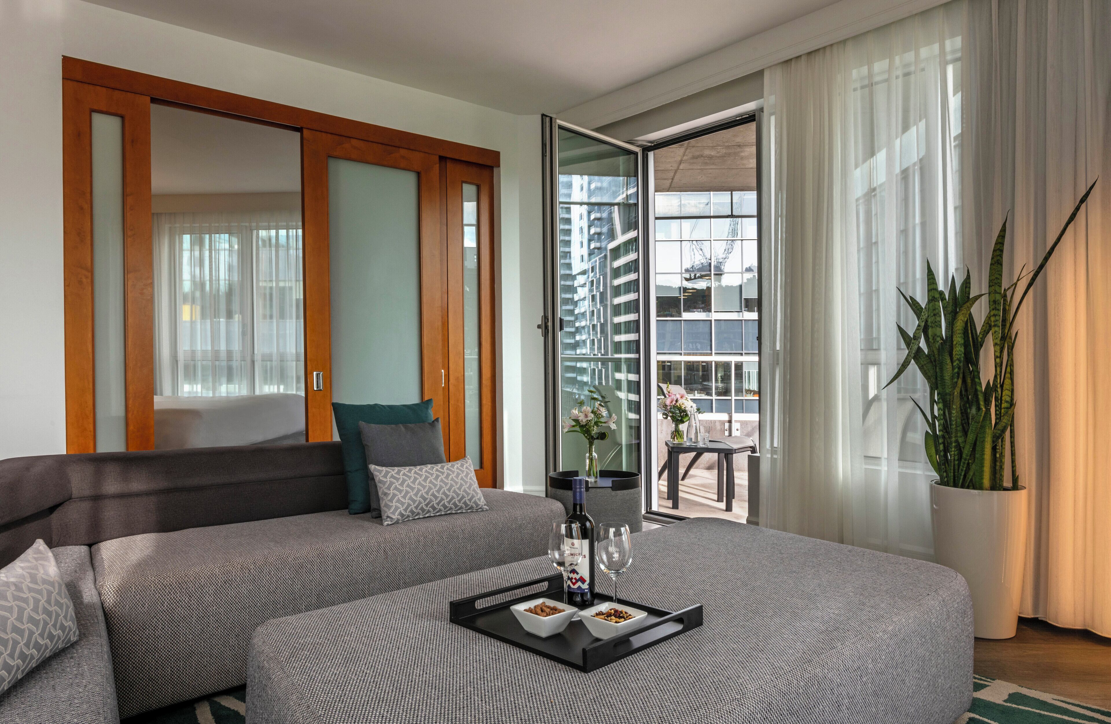 Warwick Premier Suite | Living area | 40-inch TV with satellite channels, pay films, offices