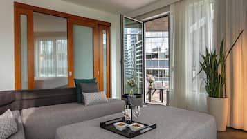 Warwick Premier Suite | Living area | 40-inch TV with satellite channels, pay movies, offices