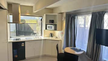One Bedroom Downstairs Spa Unit | Desk, blackout drapes, iron/ironing board, free WiFi