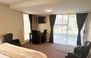 Deluxe Studio | Living area | LED TV, DVD player -  Castles Motel and Driftwood Motel (Nelson)