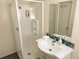One Bedroom Downstairs Spa Unit | Bathroom | Free toiletries, hair dryer, towels