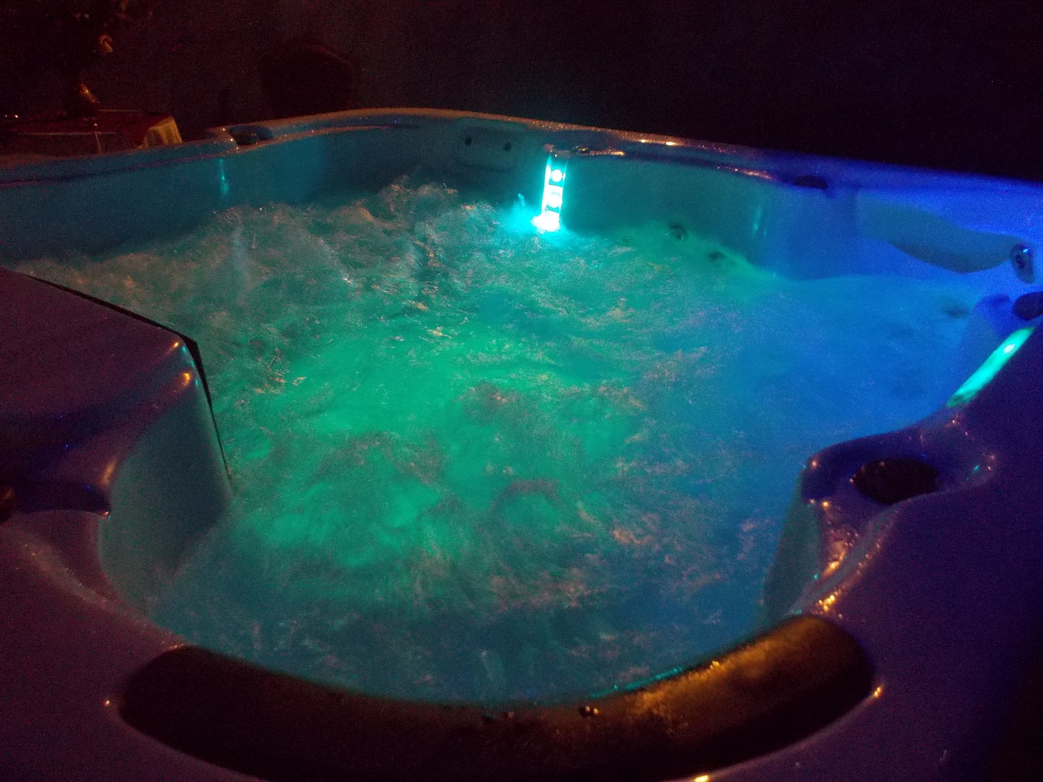 A hot tub with a blue light.