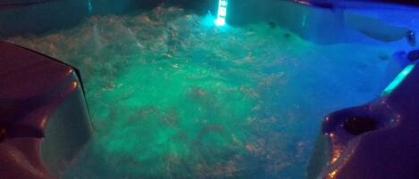 A hot tub with a blue light.
