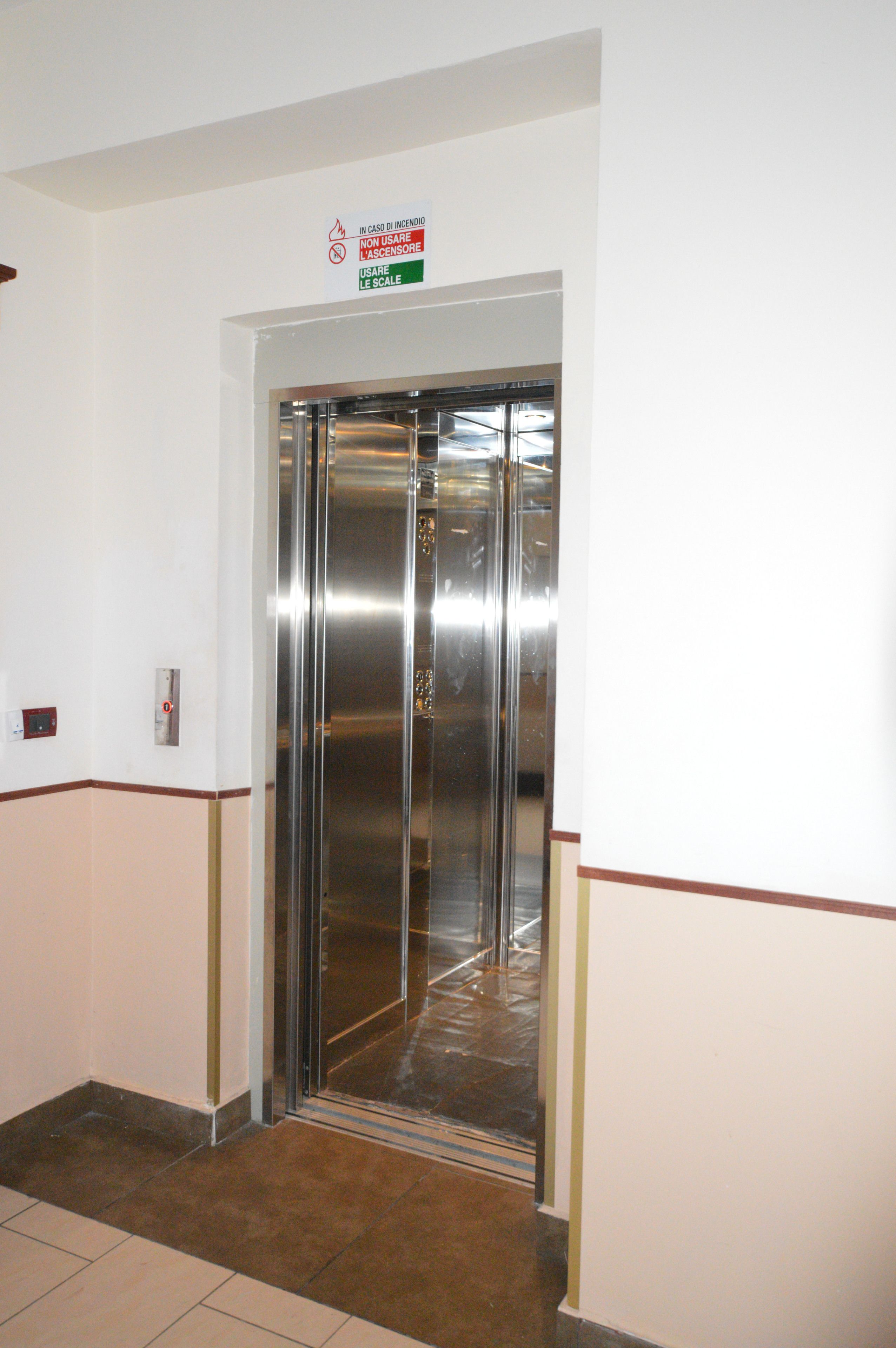 An elevator with a sign above it.