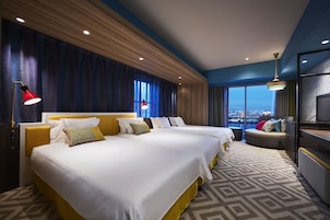 Carib Deluxe Corner Room 4 people- Non-Smoking | In-room safe, blackout drapes, iron/ironing board, free WiFi