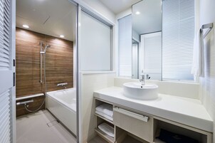 Separate tub and shower, free toiletries, hair dryer, slippers