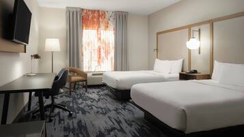 Pillowtop beds, desk, blackout drapes, iron/ironing board