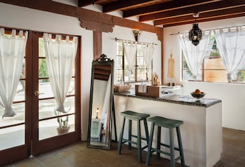 Standard Room, 1 Queen Bed, Pool View (Mykonos Suite) | Private kitchen | Fridge, coffee/tea maker at Korakia Pensione