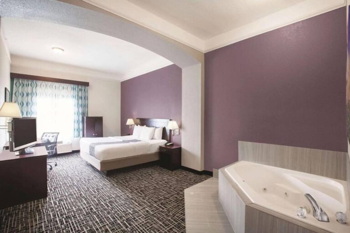Premium bedding, desk, laptop workspace, blackout curtains
