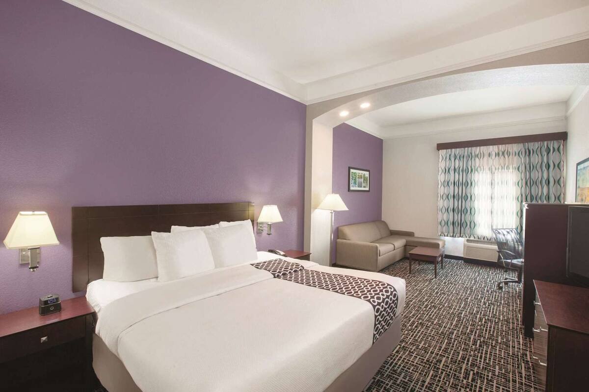 Premium bedding, desk, laptop workspace, blackout curtains