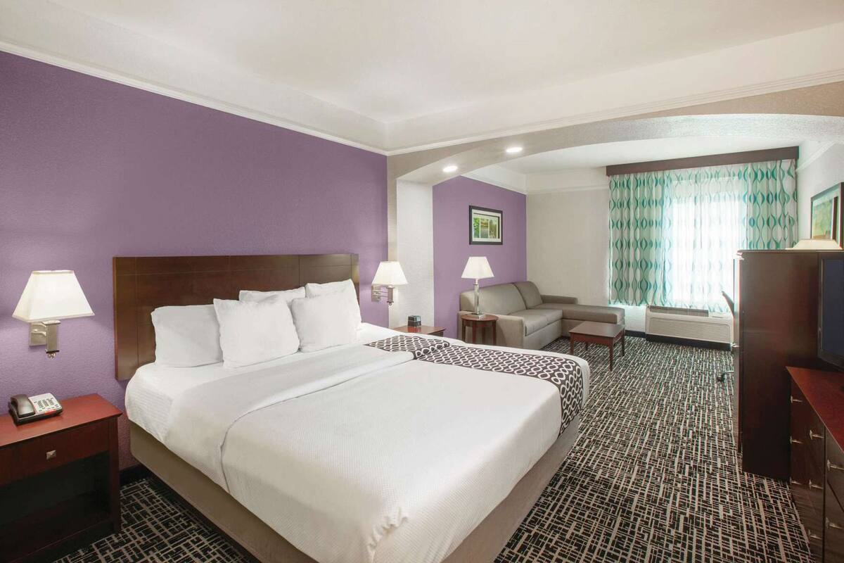 Premium bedding, desk, laptop workspace, blackout curtains