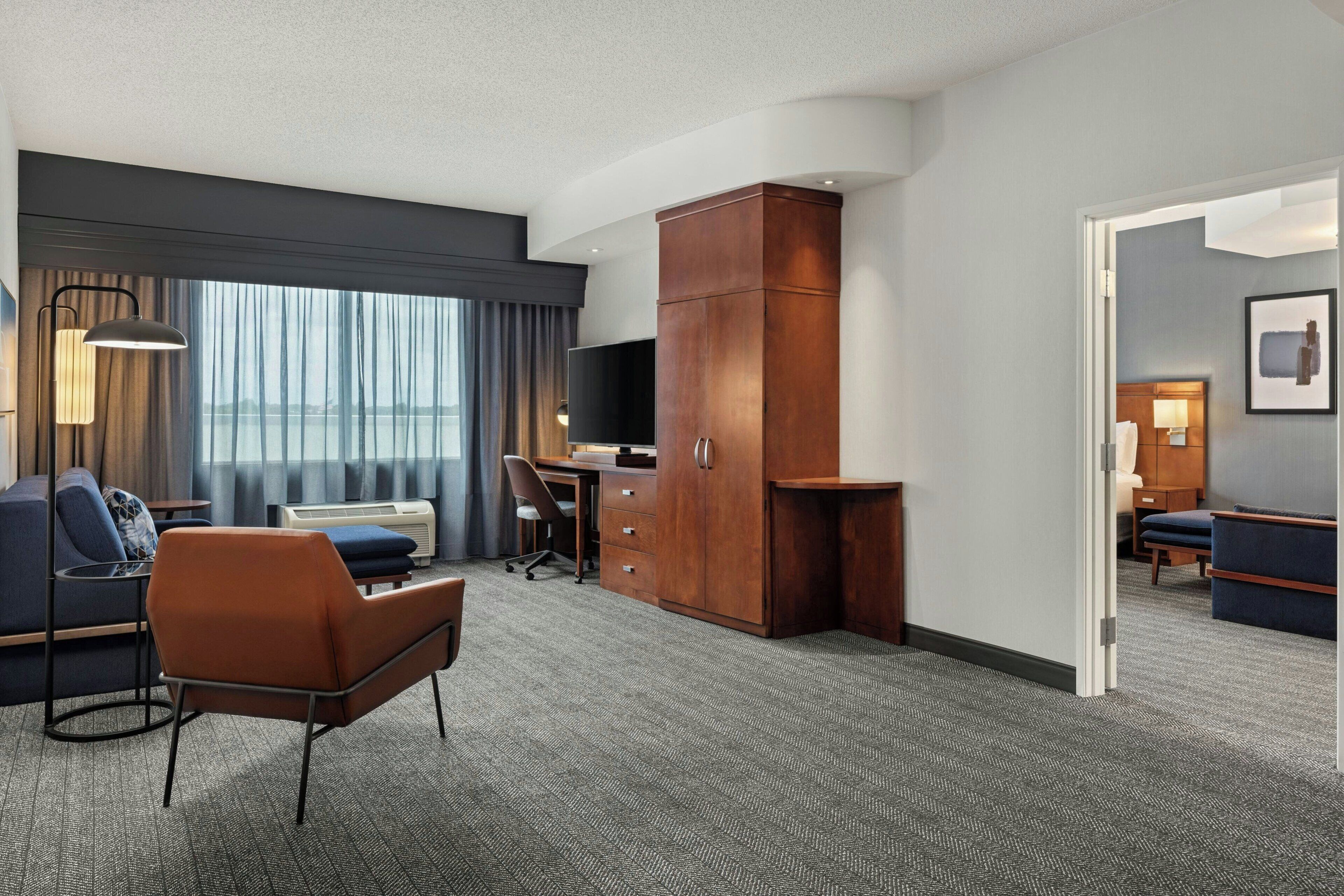 hypo-allergenic bedding, desk, laptop workspace, blackout curtains