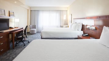 Hypo-allergenic bedding, desk, laptop workspace, blackout drapes