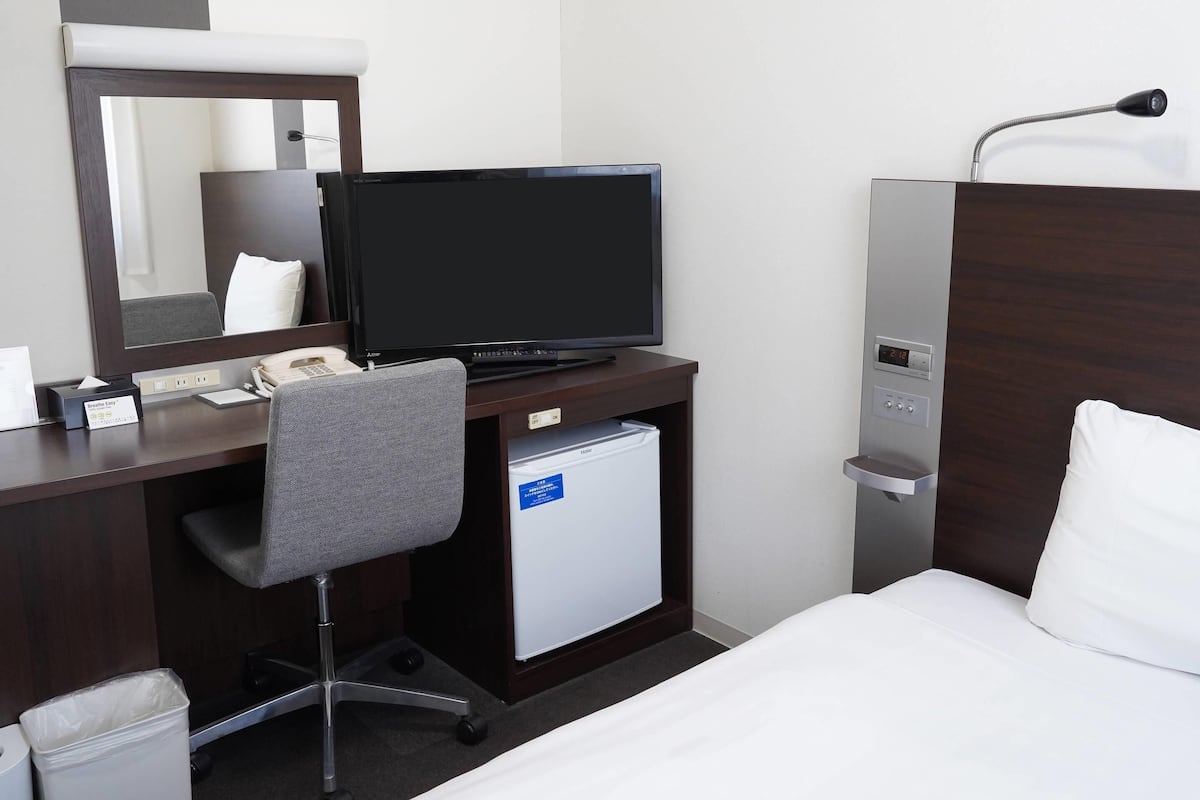 Premium bedding, desk, laptop workspace, blackout curtains