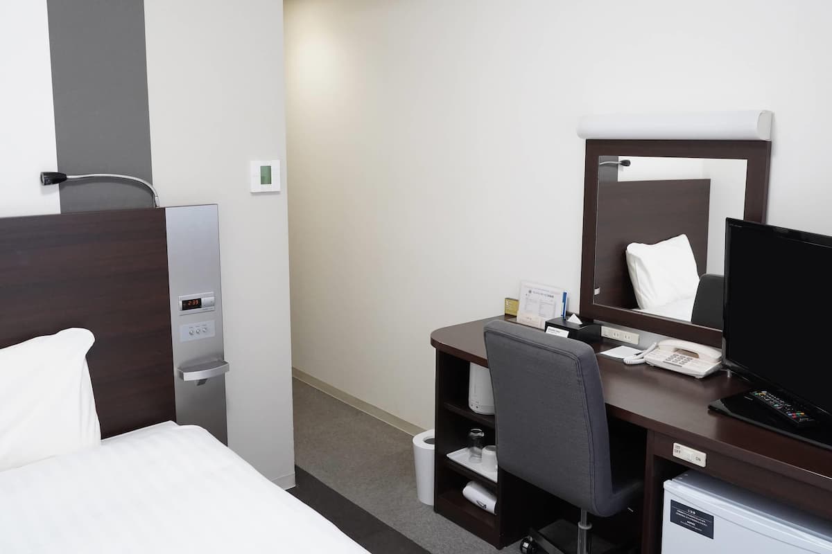 Premium bedding, desk, laptop workspace, blackout curtains