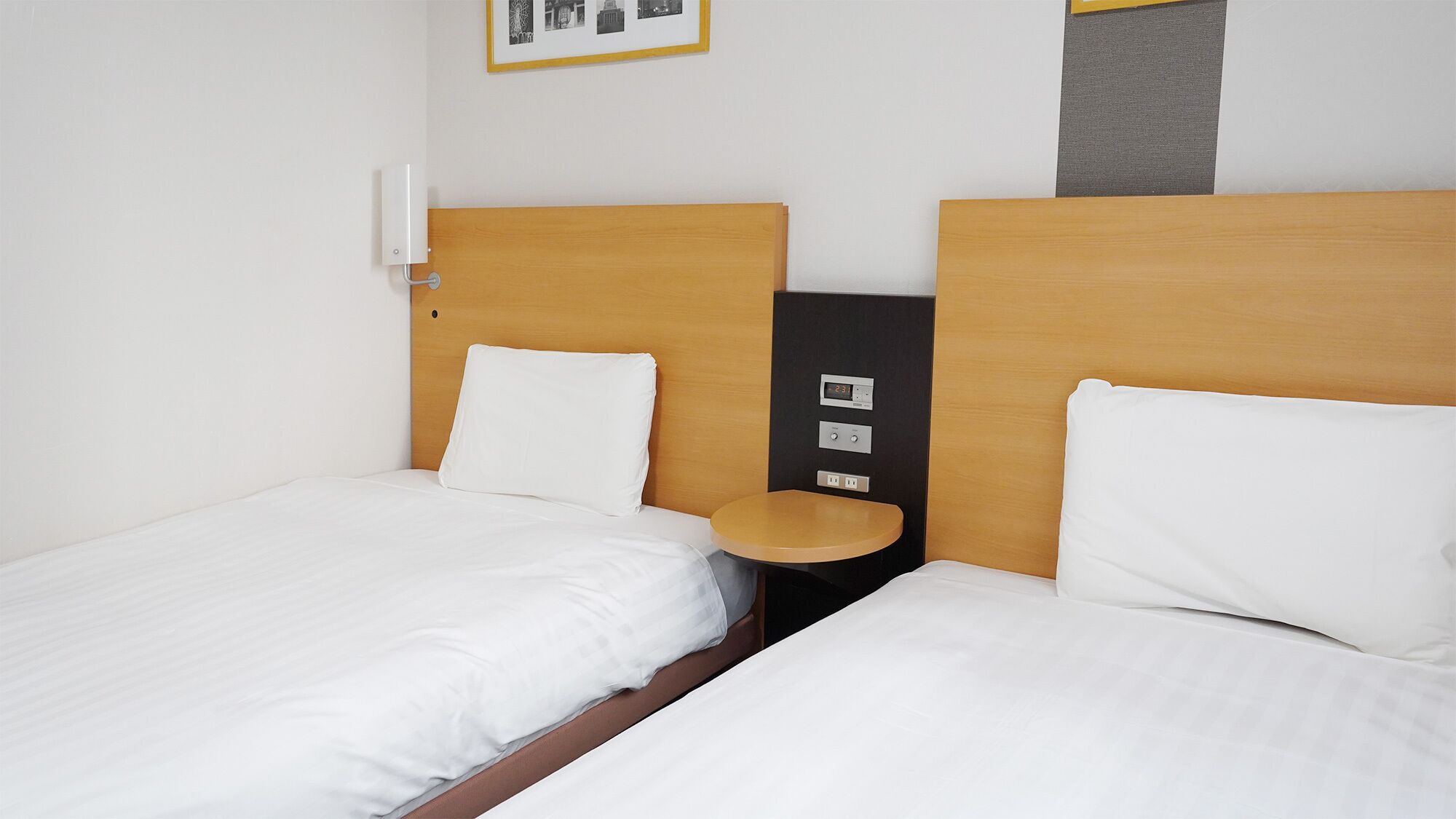 Premium bedding, desk, laptop workspace, blackout drapes