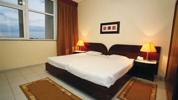 Standard Double or Twin Room | Minibar, in-room safe, desk, blackout drapes