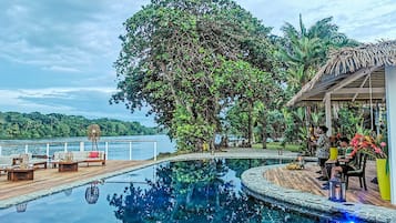 Outdoor pool, open 8:00 AM to 7:00 PM, pool umbrellas, pool loungers