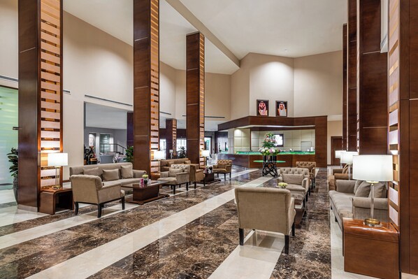 A spacious lobby with a reception desk, multiple seating areas, and a pool table. - Holiday Inn Riyadh al qasr by IHG (Riyadh)