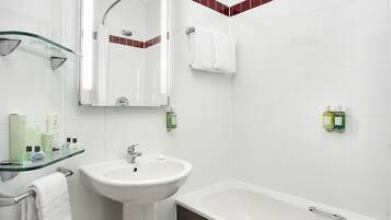 Combined shower/tub, hair dryer, towels, toilet paper