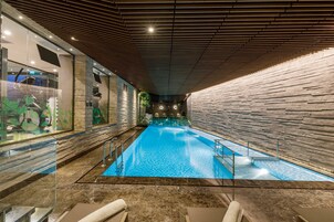 Indoor pool, open 9:00 AM to 10:00 PM, pool loungers
