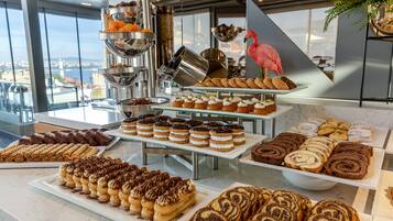 A buffet with various pastries and desserts.
