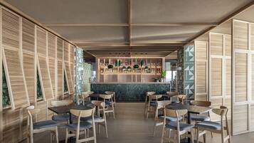 A modern restaurant with wooden furniture and a bar area.