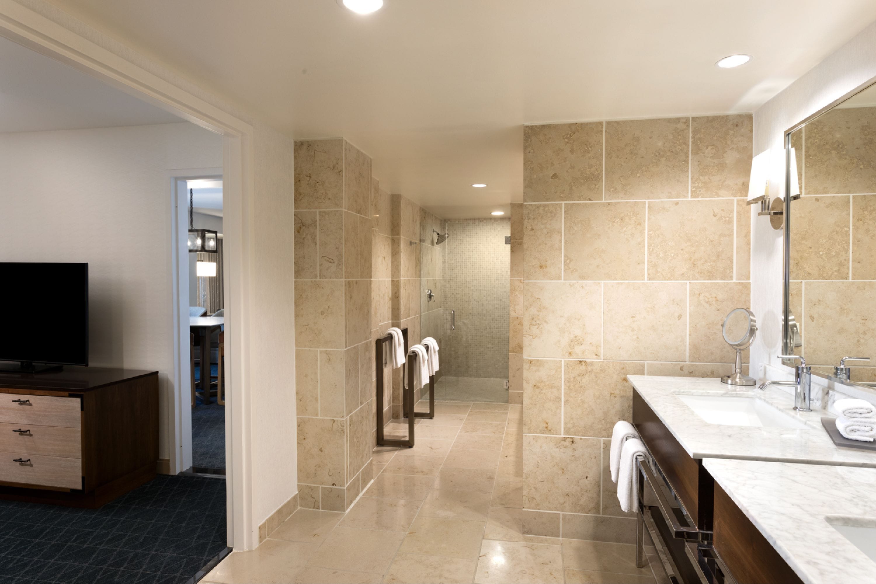luxury suite | bathroom | combined shower/bathtub, designer toiletries, hair dryer, towels