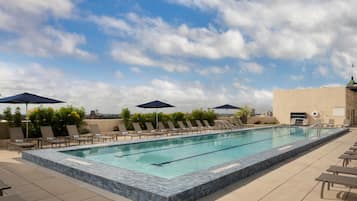 Outdoor pool, open 6:00 AM to 10:00 PM, pool loungers