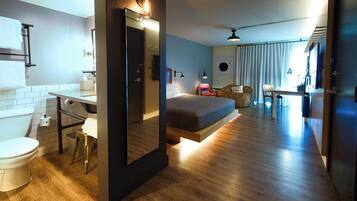 Premium bedding, desk, laptop workspace, blackout drapes