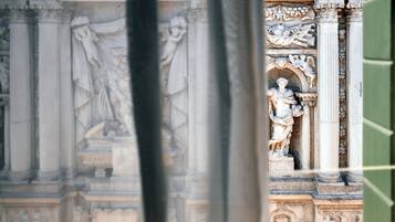 A view of a classical architectural structure with detailed sculptures and columns.